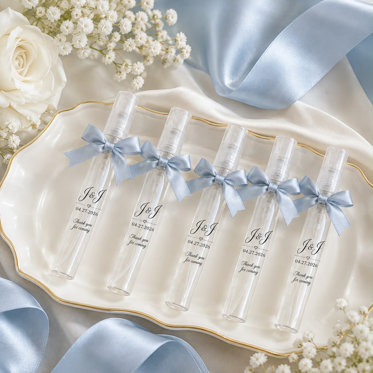 Row of 10ml plastic perfume tube sprays tied with ribbon, the Basic package keepsake