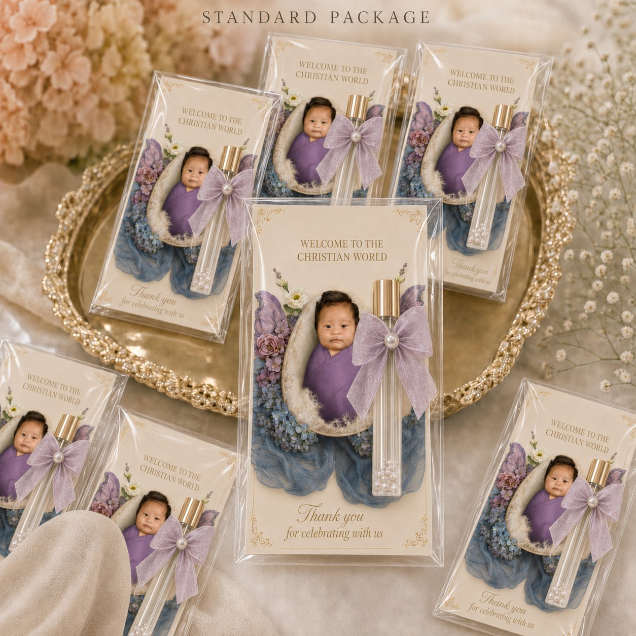 Glass perfume vials arranged on a gold tray beside customised photo cards